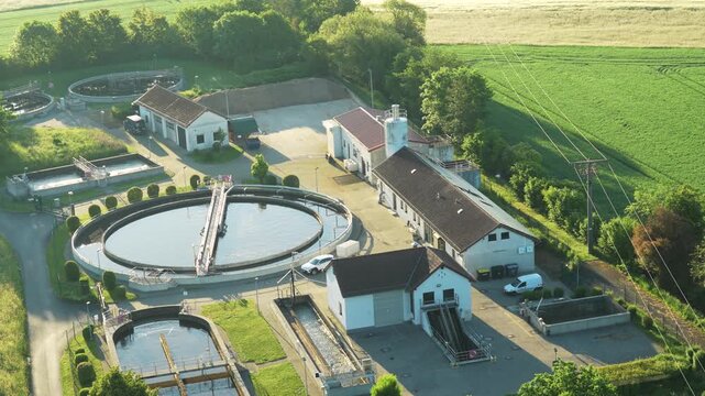  Aerial view of modern industrial sewage treatment plant at sunset.