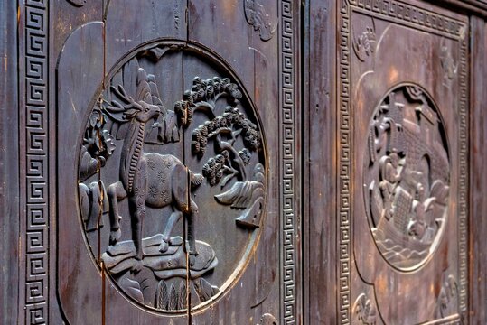 Exquisite wood carvings showcase craftsmanship in Da Fu Di civil residence from 1699 in Shenzhen Guangdong China
