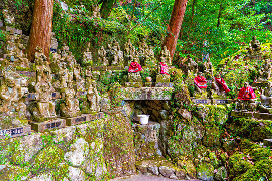 Stone sculptures of monks and arhats at Nanzoin Temple show religious art and cultural heritage in Fukuoka, Kyushu, Japan