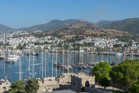 View of Bodrum Harbour from Saint Peters Castle overlooking boats and hills in Turkey