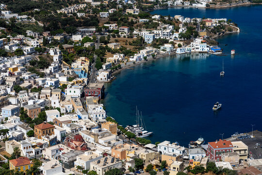 Vibrant coastal view of Agia Marina on Leros Island under clear skies in Greece with boats anchored in the water