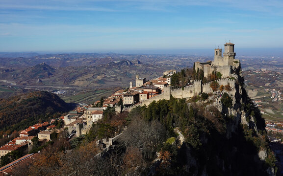 View of the City of San Marino on Monte Titano with historic buildings and scenic landscape under clear sky