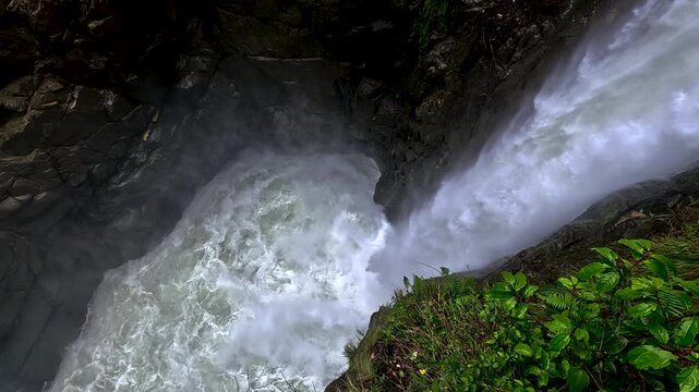 Powerful Waterfall and Whitewater River in Narrow Ecuador Gorge, Mist, Green Vegetation, Rocky Canyon and Scenic Nature Travel Background