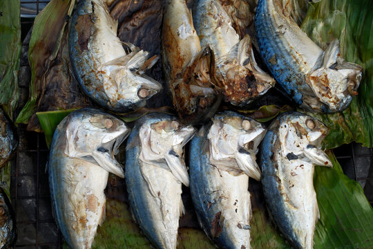 Fish wrapped in banana leaf for sale at local market in Luang Prabang Laos