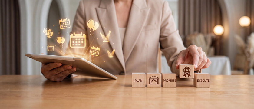 Event management concept with a professional planner using a digital tablet and wooden blocks representing the planning and execution process