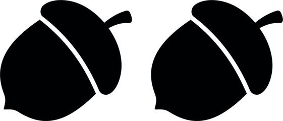 Minimalist black acorn silhouette vector icon set isolated on white background for autumn season decoration and forest nature logo design © MstBizly