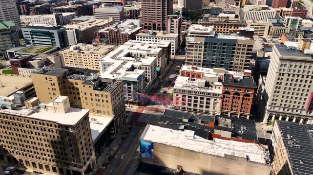 A cinematic drone shot capturing the modern skyline of Columbus, Ohio, USA, showcasing downtown architecture, urban development, office buildings, streets, and the vibrant atmosphere of the state capi