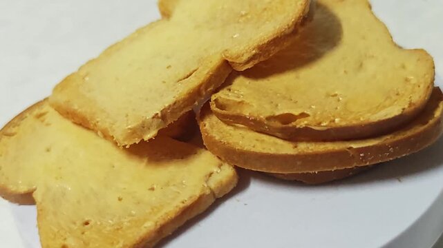 Crispy butter toast on plate.