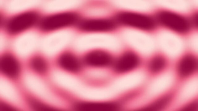 Abstract pink and maroon blurred background with circular patterns