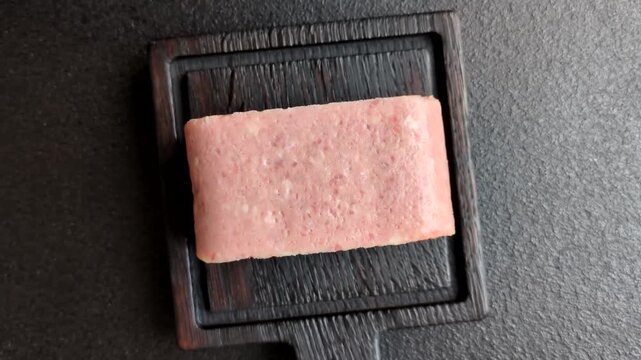 Canned spiced ham slices for holiday sandwiches. Ham slices as a food background for your design