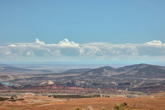 Mining operation in a valley surrounded by canyon terrain