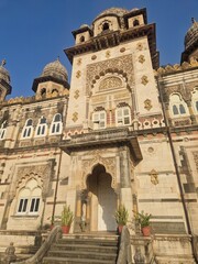 Fototapeta premium Ornate Indian palace facade beneath a clear blue sky