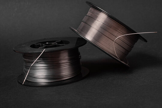 Two MIG Welding Wire Spools Close Up