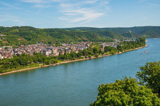 Rhine River Panoramic Aerial View with historic German Town, lush green Hills, River Cruise Boat, and scenic Valley landscape on a sunny Summer Day