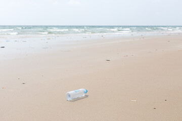 Empty Used Plastic Bottle on Remote Deserted Sea Sand Tropical Beach © Anna Babii