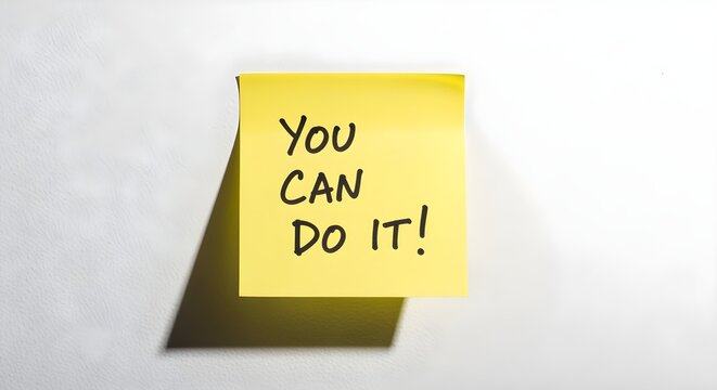 A single, yellow sticky note with the handwritten words "You Can Do It!" on a white wall.