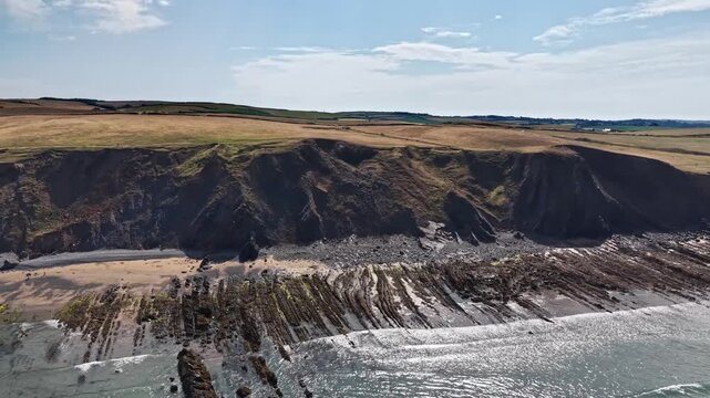 Aerial drone panoramic view of Cornwall's Sandymouth Bay 