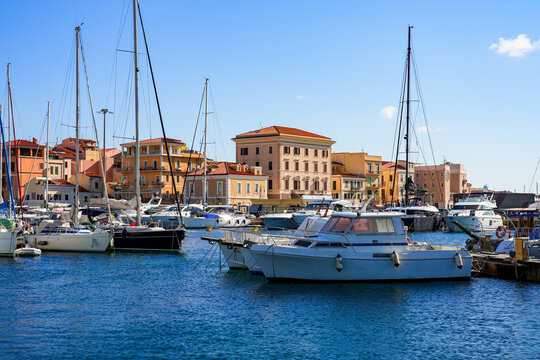 Yachts and sailboats in the port of Cala Gavetta in La Maddalena, capital city of the eponym archipelago located in the Mediterranean Sea in north-east of Sardinia, Italy