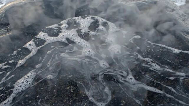 Close-up of Ice and Water Bubbles on Frozen Surface.