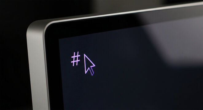 Hashtag symbol on computer screen with mouse cursor, social media marketing concept, digital communication on monitor