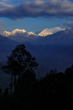 Title
Sunrise over Mount Kanchenjunga Range from Pelling Sikkim India with Snow Capped Himalayan Peaks Golden Morning Light Scenic Mountain Landscape