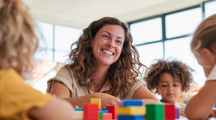 Fototapeta premium Woman Teacher Engaging Children with Lego Blocks in School Setting