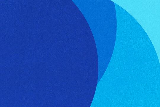 Bold blue circles overlap in soft gradient tones. Smooth texture adds depth to abstract composition.