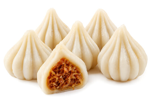 Modak, traditional steamed rice flour dumplings filled with coconut and jaggery