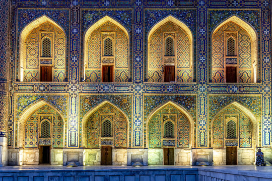 Exploring the intricate tile work of Tilla Kari madrasa in the Registan of Samarkand, Uzbekistan during sunset hours