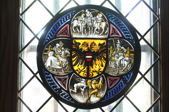 Quatrefoil roundel stained glass with imperial arms of Austria and secular scenes. German, ca. 1490-1500. The Met Cloisters, New York, USA.