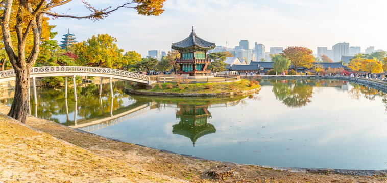 View of Hyangwonjeong Pavilion at Gyeongbokgung Palace during golden hour in autumn in Seoul South Korea
