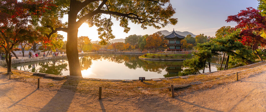 View of Hyangwonjeong Pavilion at sunset during autumn in Gyeongbokgung Palace in Seoul, South Korea