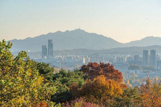 View of Seoul skyline from N Seoul Tower during golden hour in autumn in Yongsan District, South Korea