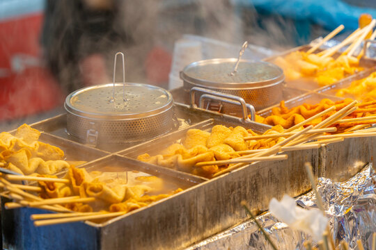 Hot food stalls attract shoppers at night market in Jung District, Seoul, South Korea