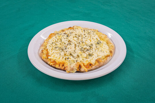 Brazilian pizza 4 Queijos - Delicious four Cheese Pizza on White Plate
