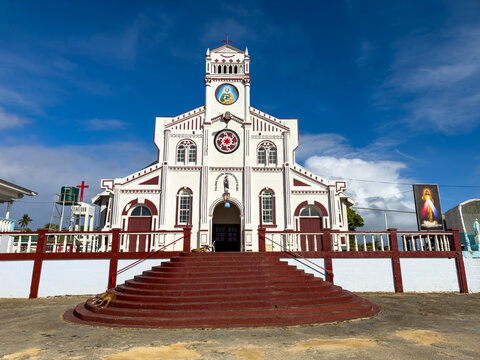 Views of the Catholic Church on Vavau Island in Tonga with clear skies and church steps