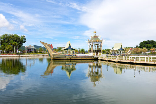 Ceremonial stone barge located in mosque complex with reflections in water in Bandar Seri Begawan, Brunei