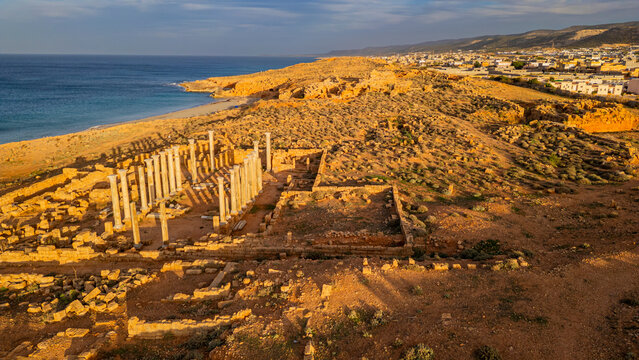 Exploring the ruins of ancient Apollonia in Eastern Libya by the coastline and reflecting history of the past