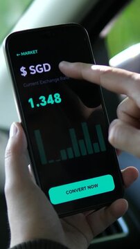 A user monitors the Singapore Dollars performance against the USD via a sleek mobile interface. The visual narrative highlights how global finance data is made accessible