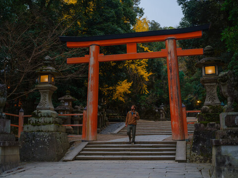 Man walks through the forest in Japan in autumn 