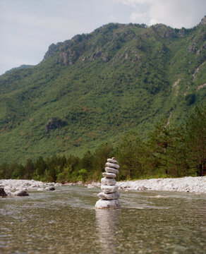 Stack of stones balanced in the river in Albania 