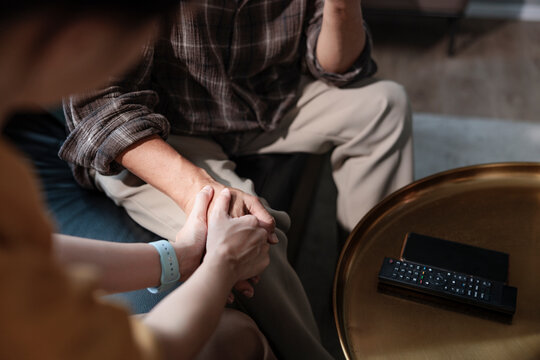 Comforting hands offer support and connection in a moment of need.