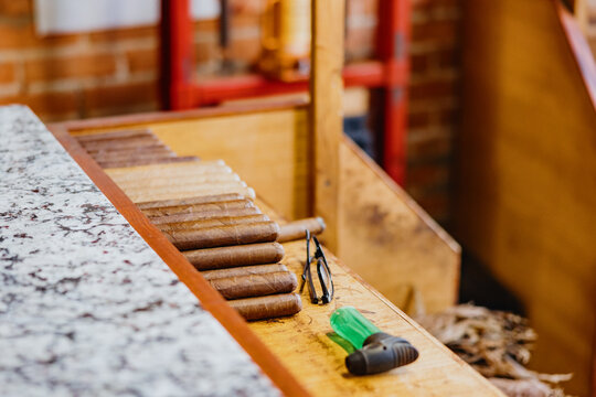 Handmade Cigars on Wooden Rolling Table