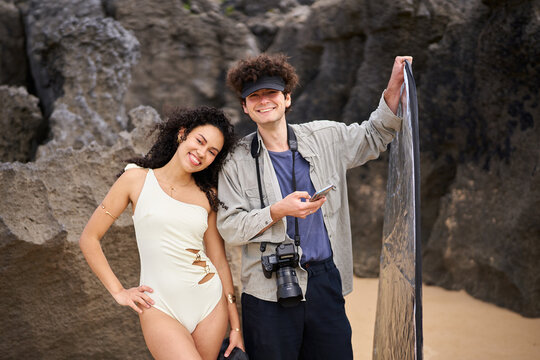 Model and photographer working on a creative beach photoshoot