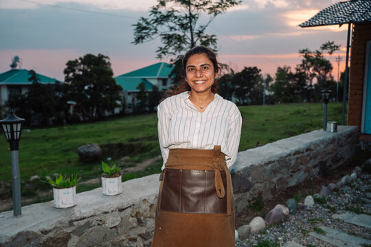 Small business owner smiling portrait at dusk