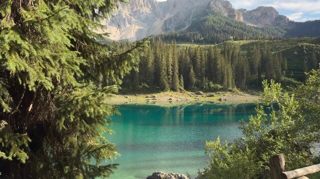Lake Carezza Framed by Pine Branches, Turquoise Water Beneath Dolomite Peaks South Tyrol Italy Alpine Forest View