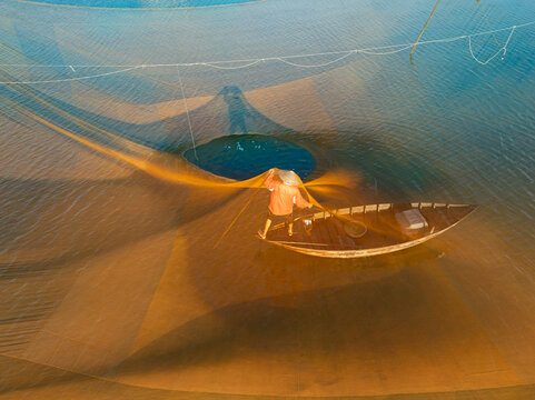 Fisherman Inside Fishing Net