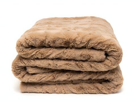 Stack of brown fuzzy blankets for home and bedroom, isolated on white background