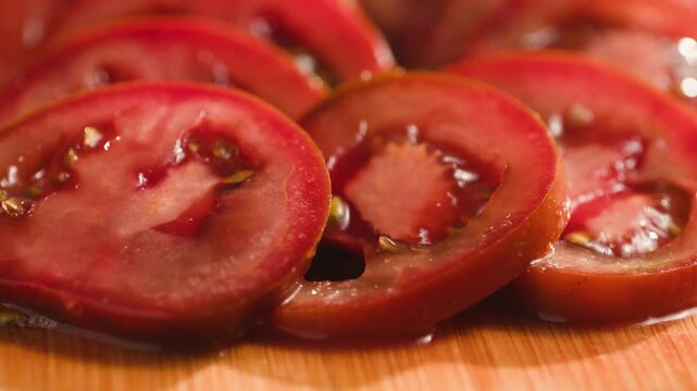 Chop tomato close up, Diced kumato tomatoes on a cutting board for Italian sauce, chef cut tomatoes with knife. 