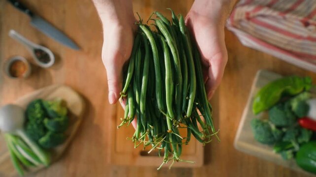 Fresh green beans and vegetables on a wooden table, spanish extra fine beans, chinese long bean. 